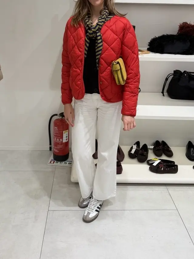 Red quilted jacket, white jeans and sneakers