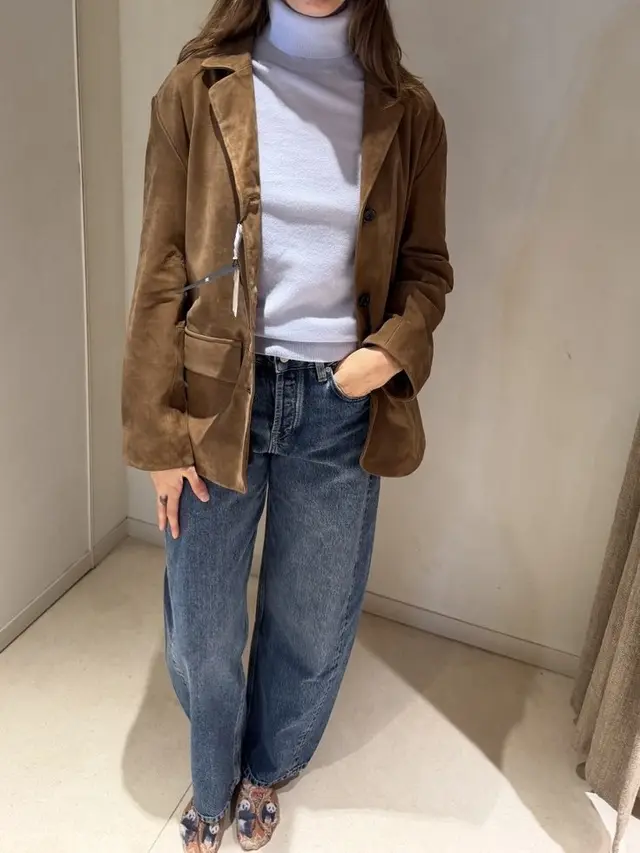 Suede blazer with a light blue turtleneck and jeans
